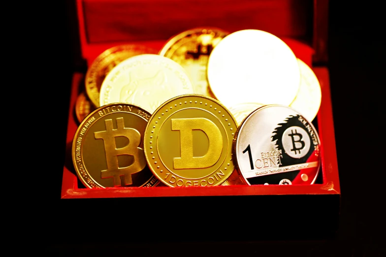 a box filled with different bit coin next to each other