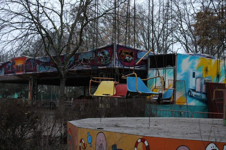 several colorful playgrounds with different kinds of slides