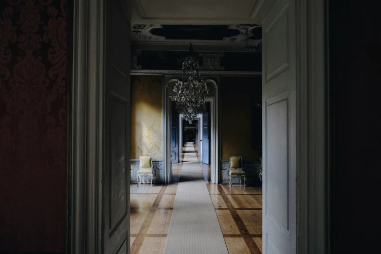 hallway of a classic building with white walls