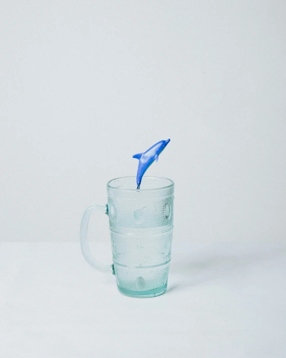 blue plastic toothbrush in a cup