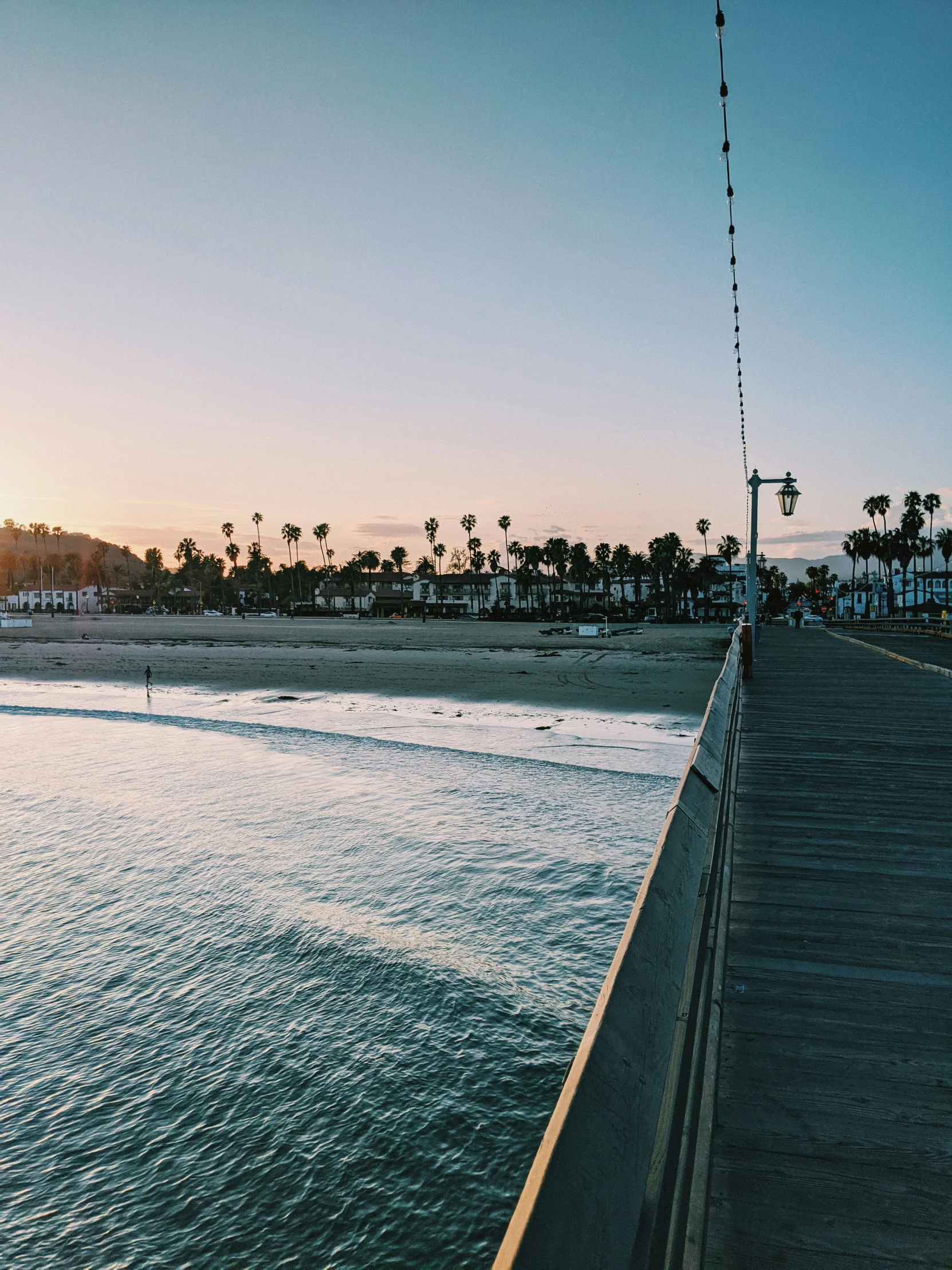 a long wooden pier stretches into the water