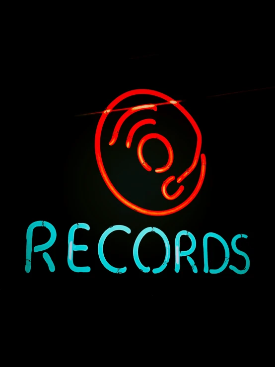 a red neon sign that reads records on the back