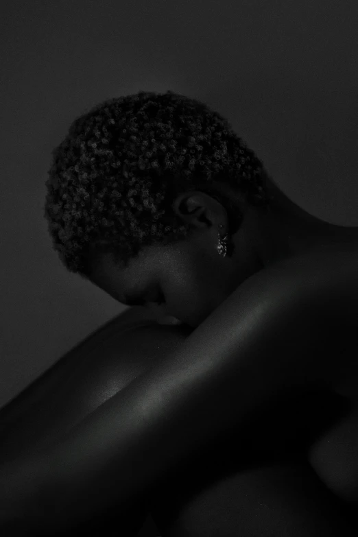 a black woman with her arms behind her back