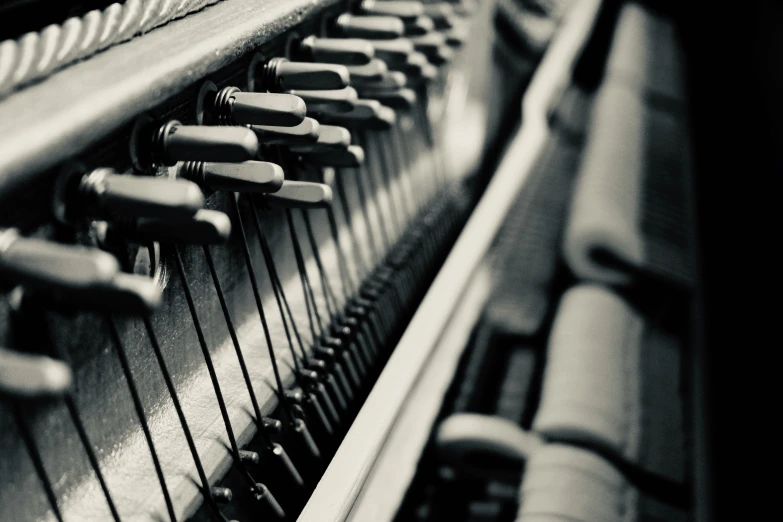 a close up view of an upright, wood - grain piano