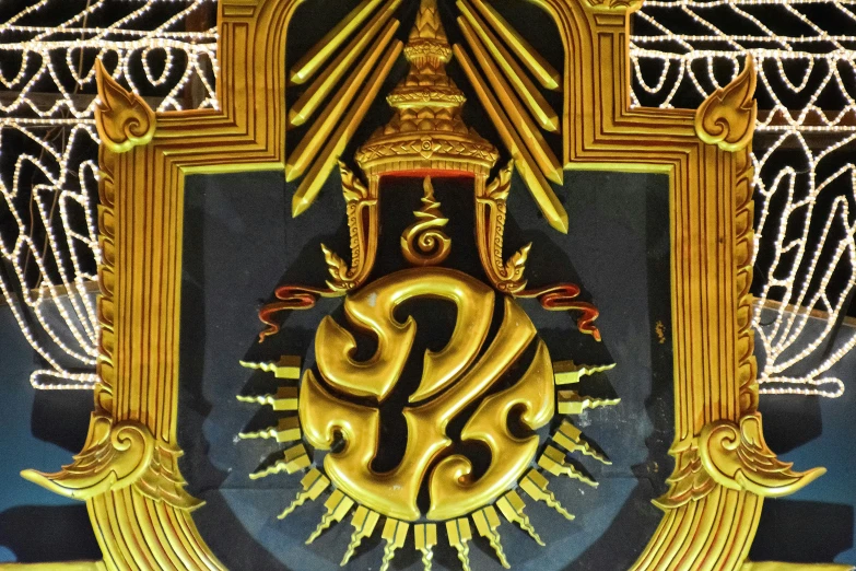 a painting of an emblem in front of a blue and gold background
