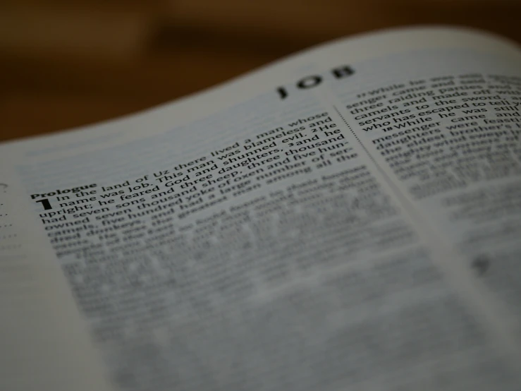 an open bible with the word of jesus on it