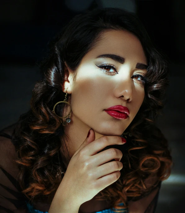 a beautiful young lady with dark eyes and red lips