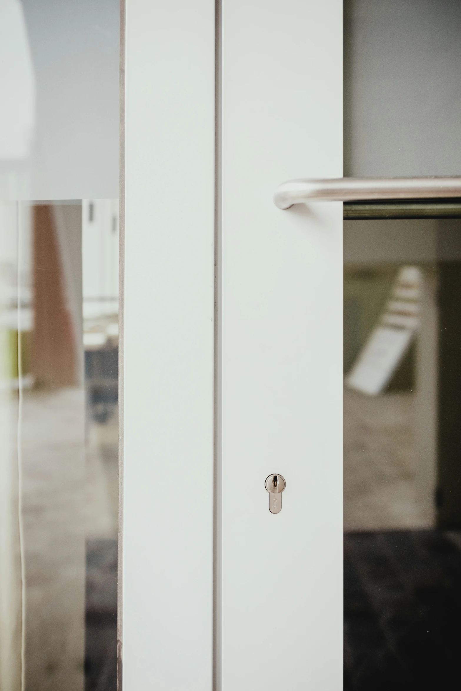 the door is opened revealing some white furniture