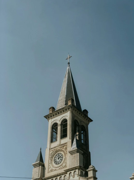 the steeple of a church with a clock on it