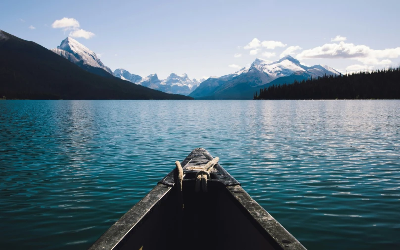 a small boat in the middle of a lake