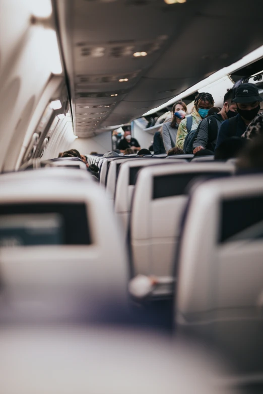 people in the seat area of a train