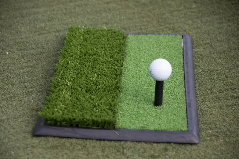 a golf ball on top of a green course