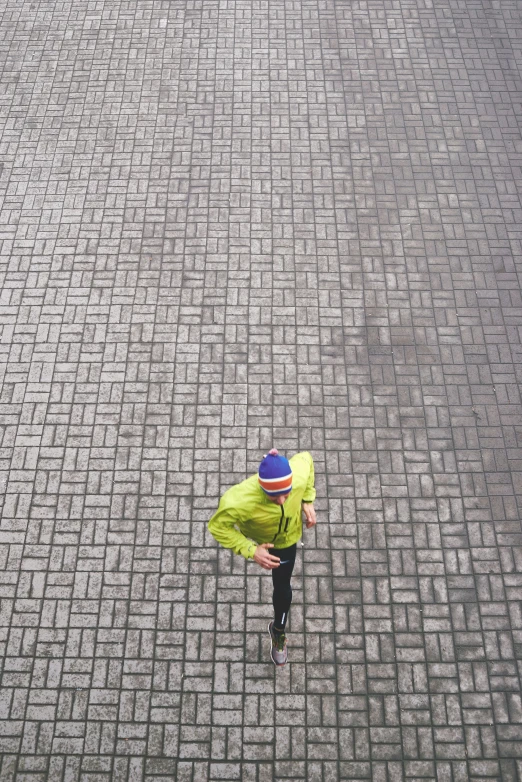 a man that is standing in the dirt with a frisbee