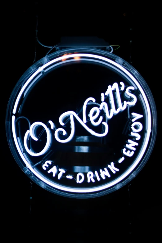 a neon sign is lit up for a night of music