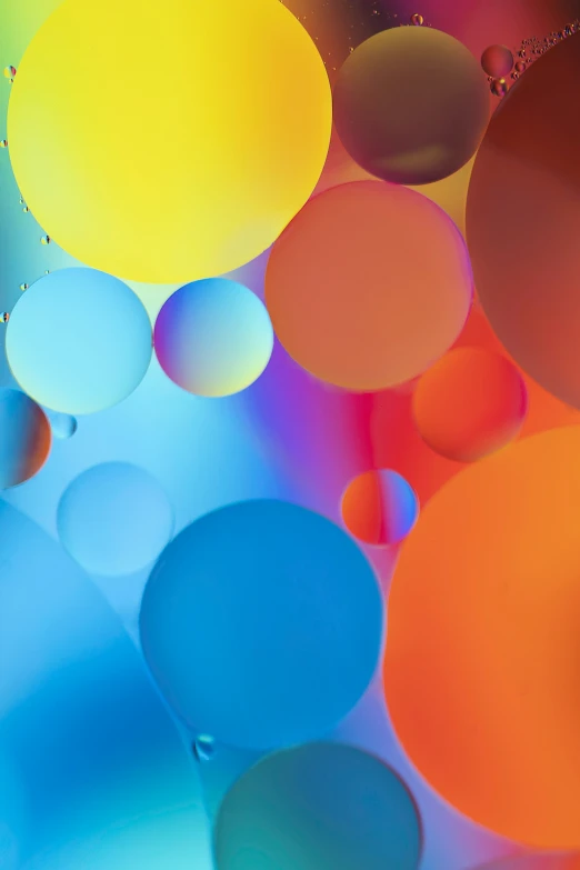 an up close s of colored balloons and a water drop