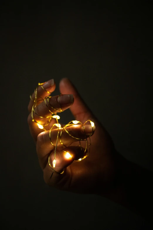 a hand with some glowing lights on it