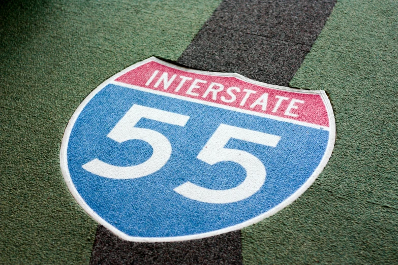 the number fifty sign on the street is painted blue