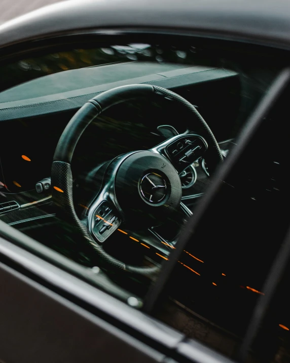 a view from the inside of a car's steering wheel