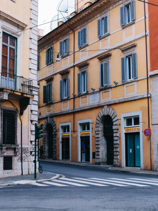 an old building has several open windows on the outside