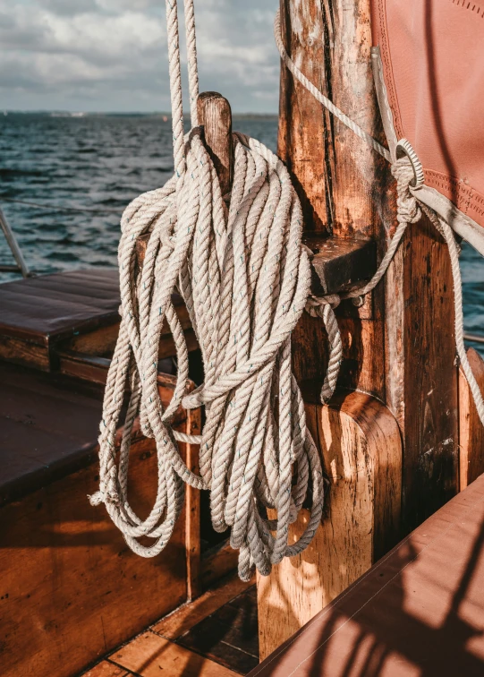 ropes hang from the rig of an old boat