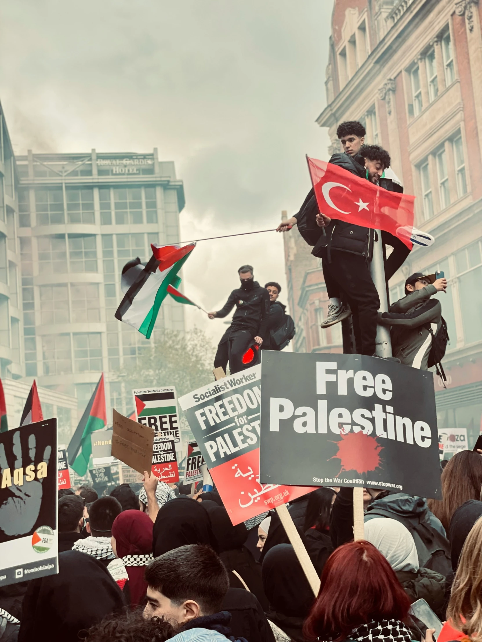 protesters with signs and banners on a city street