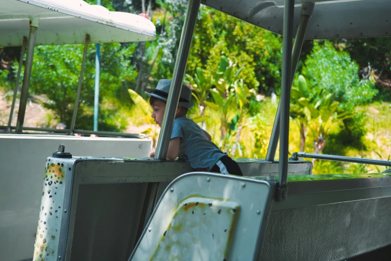 a person in a hat sitting on a boat