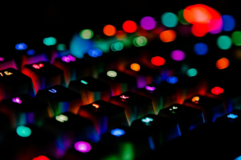 a close up of a colorful illuminated keyboard