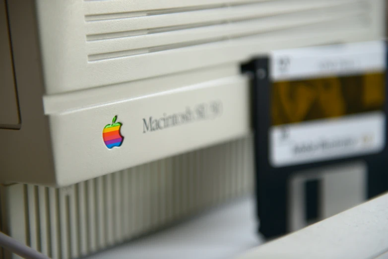 an apple computer with the logo for macintosh 90 on it