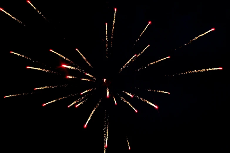 a large fireworks in the dark and a large jet flying through the air