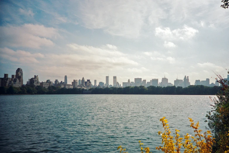 an ocean view with buildings in the background