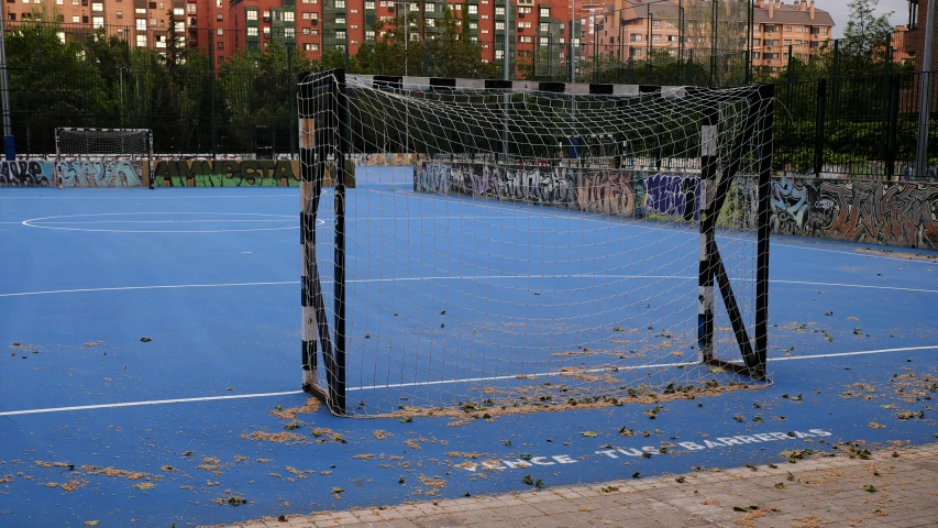 the tennis court is littered with all sorts of debris