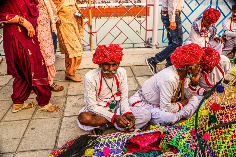 group of men in traditional indian garb working on a project