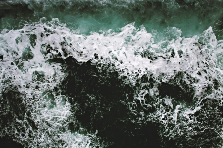 large waves moving through a calm ocean with no paddles