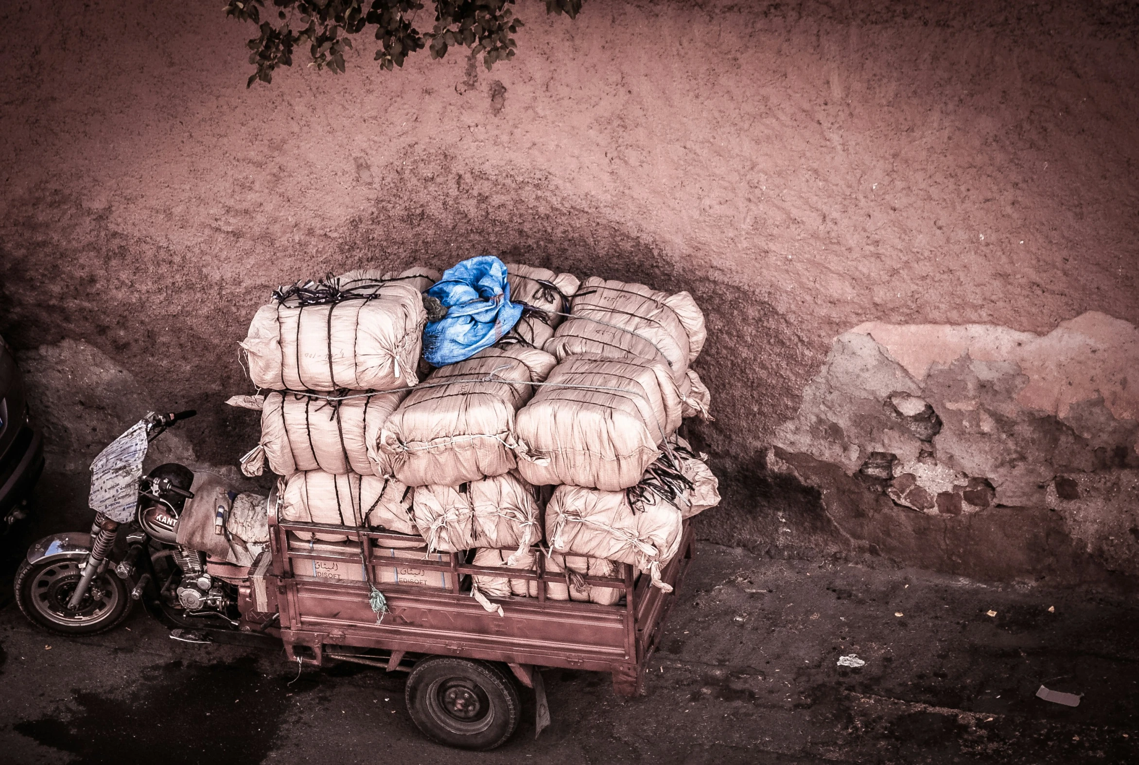 a motorcycle and a trailer loaded with cargo