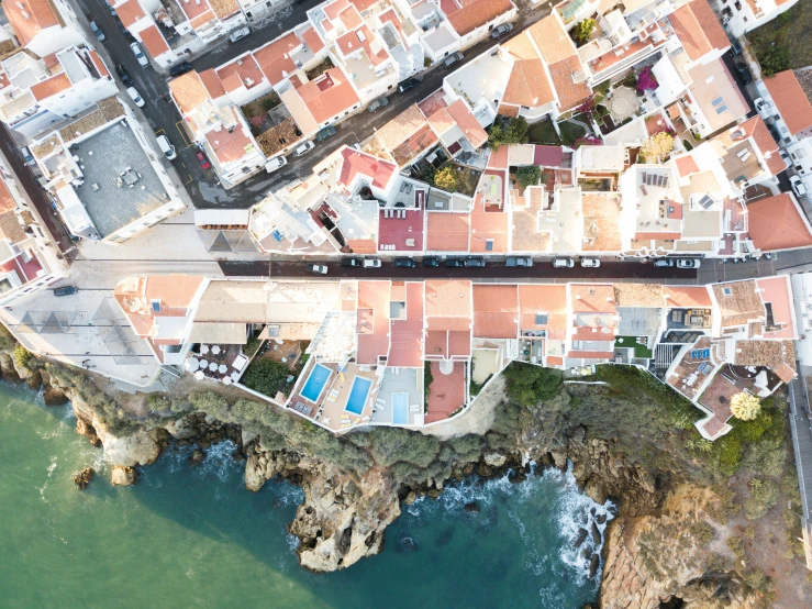 a train passes by an aerial view of the city