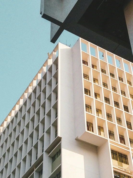 a closeup view of a tall building in front of another tall building