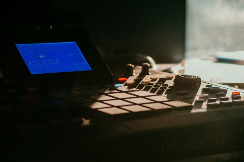 a music mixing station has a laptop and sound board in it