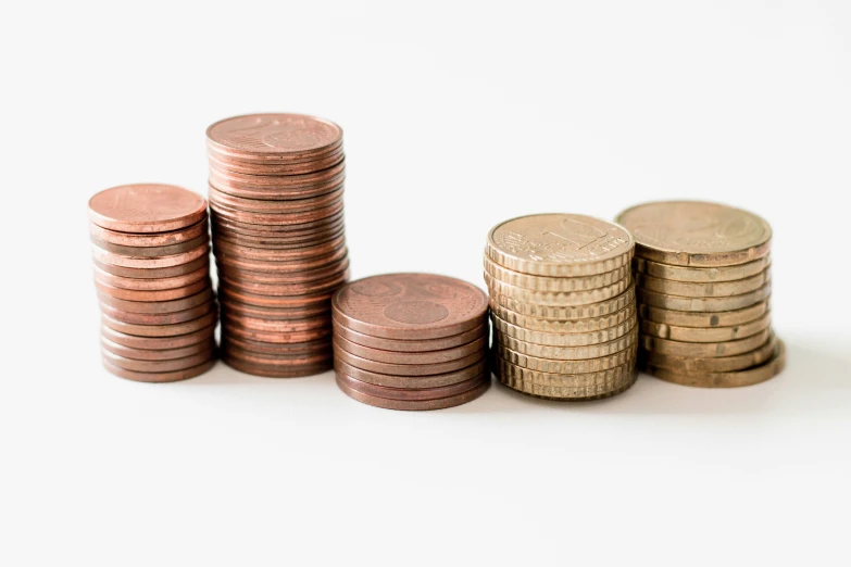 a pile of coins sitting next to some stacks of them