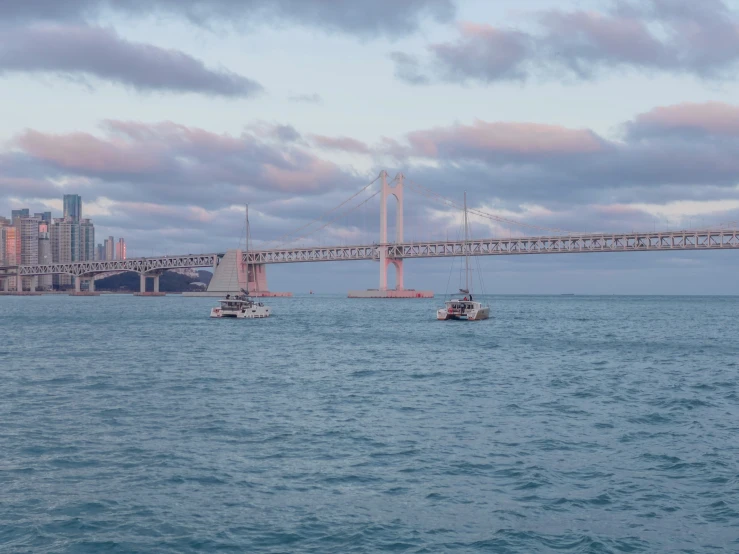 two boats that are sitting in the water