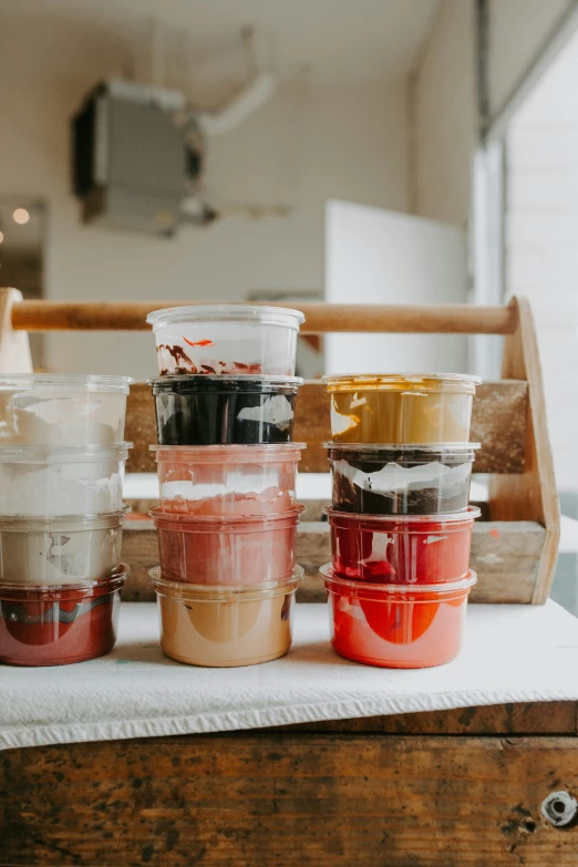 several small cups sitting on top of a wooden table