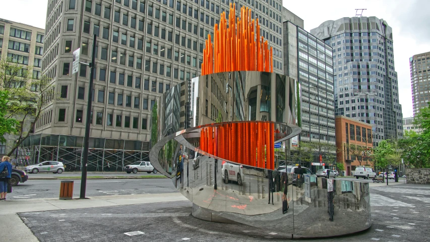 the fire burns in a building with people and vehicles on a street