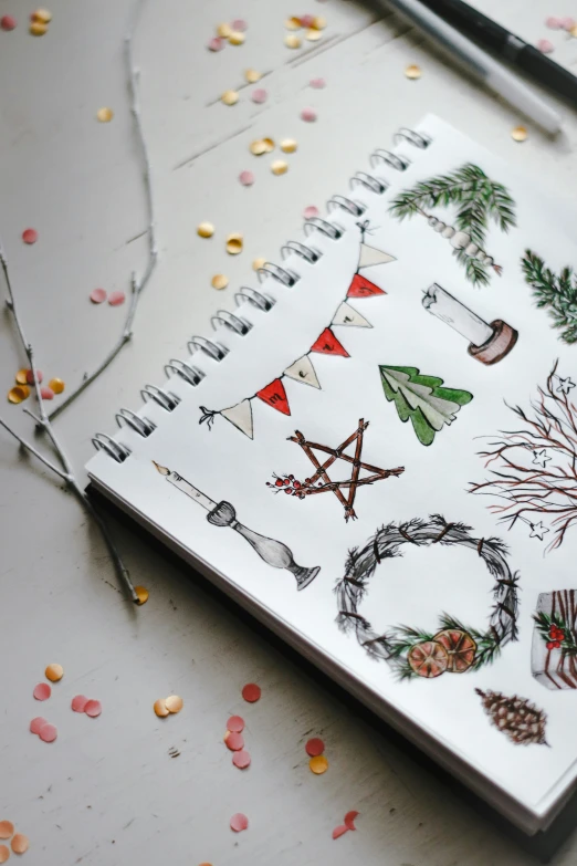 the pages have been covered in a notebook with christmas decorations on it