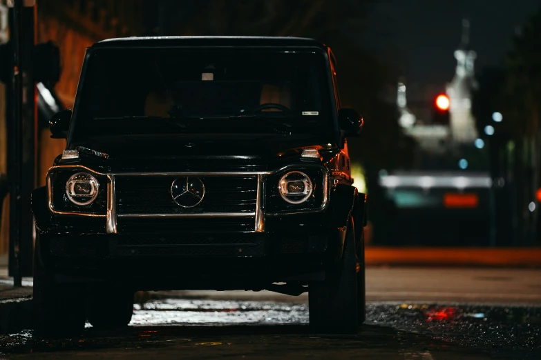 a black vehicle is parked on the street