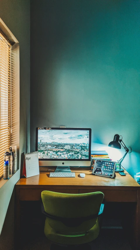 a laptop computer sitting on top of a desk