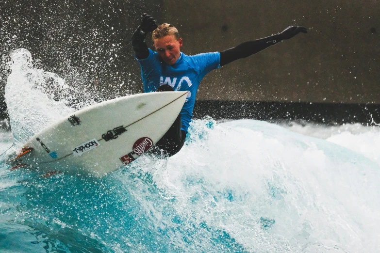 a person riding a wave on a surf board