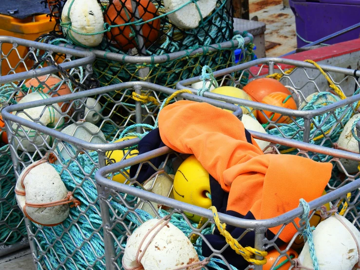 there are many ball balls and toys inside the bin