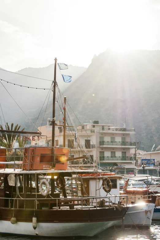 several boats docked in a bay near buildings