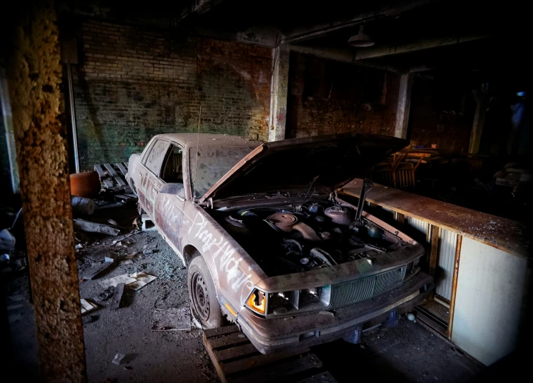 a dirty, broken down pickup truck sitting in a room