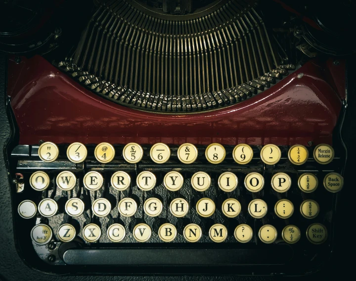 an old fashioned typewriter sitting on top of a table