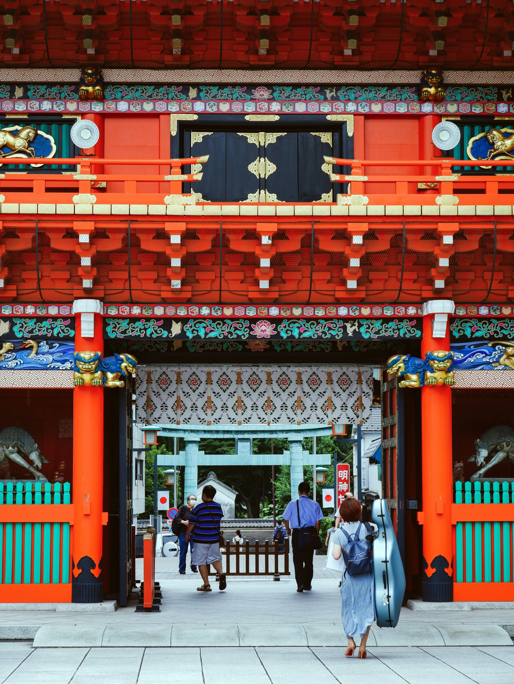 a person walking towards the entrance to a red building